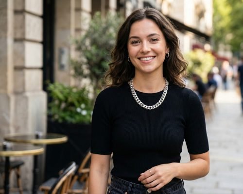 A young woman confidently wears a bold 925 sterling silver Miami Cuban Link chain from Crea7 Jewelry while walking down a sunny street in Miami